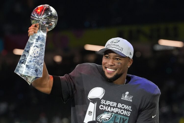 Eagles running back Saquon Barkley sets the NFL's season rushing record, including the playoffs